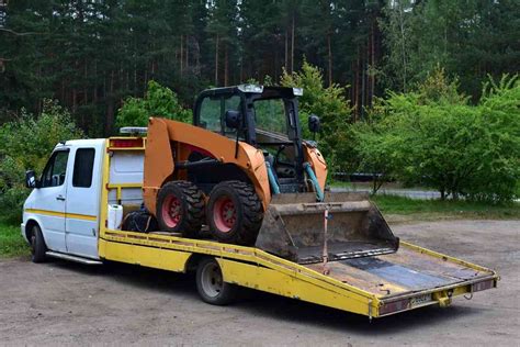 2011 gmc 1500 sierra tow a trailer with skid steer|gmc towing skid steer.